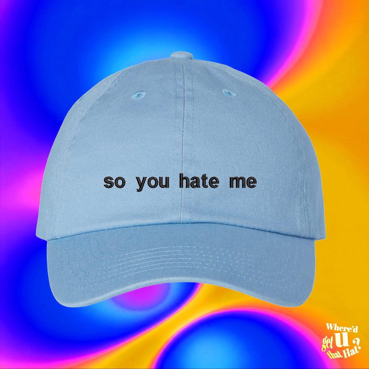 A light blue baseball cap with the text "so you hate me" printed on it, against a colorful, abstract background.